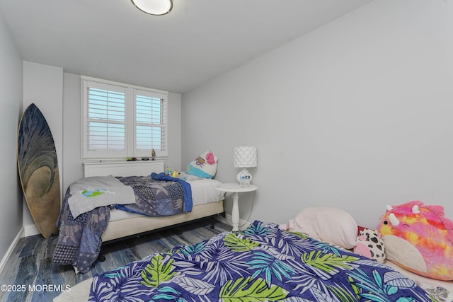 675 Ocean Ave Unit 5J, Long Branch, NJ 07740 - bedroom with baseboards and wood finished floors