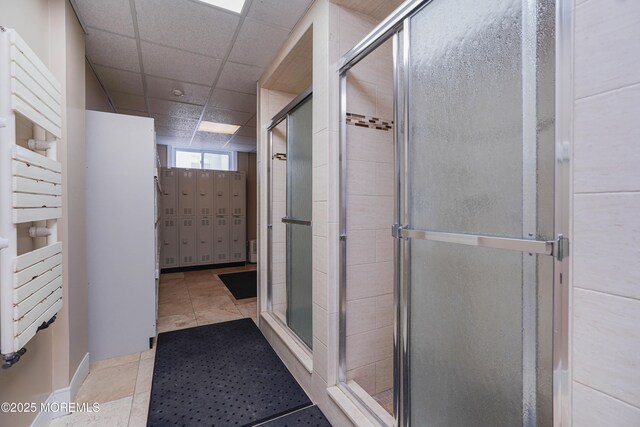 675 Ocean Ave Unit 5J, Long Branch, NJ 07740 - full bath featuring a towel warmer, a stall shower, and a paneled ceiling