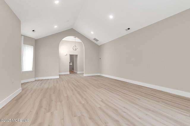 31 Orleans Dr, Manchester, NJ 08759 - spare room featuring arched walkways, light wood-style flooring, vaulted ceiling, and recessed lighting