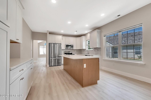 31 Orleans Dr, Manchester, NJ 08759 - kitchen featuring stainless steel appliances, healthy amount of natural light, light wood-type flooring, a kitchen island, and recessed lighting