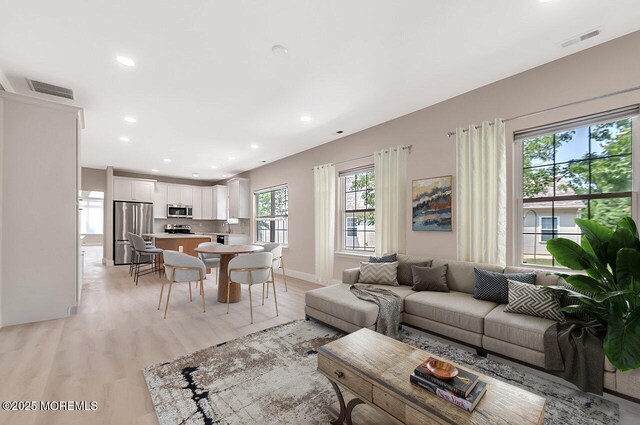 31 Orleans Dr, Manchester, NJ 08759 - living room with recessed lighting and light wood-type flooring