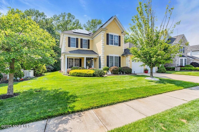 19 Carleton Dr, Freehold, NJ 07728 - traditional-style home featuring driveway, a front yard, solar panels, and an attached garage
