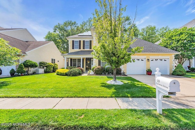 19 Carleton Dr, Freehold, NJ 07728 - view of front of house featuring driveway, roof mounted solar panels, an attached garage, a front yard, and roof with shingles