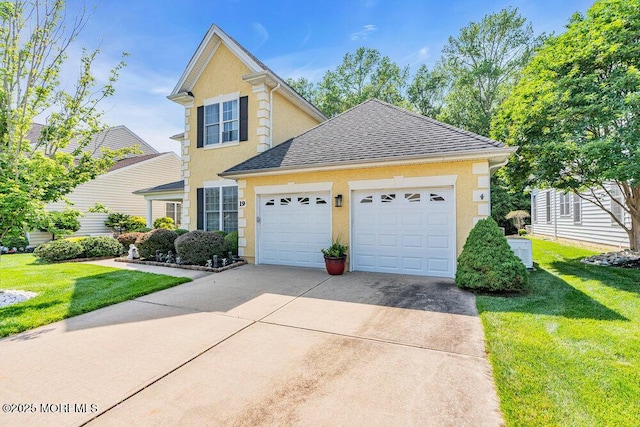 19 Carleton Dr, Freehold, NJ 07728 - traditional home with a garage, stucco siding, driveway, a front lawn, and a shingled roof