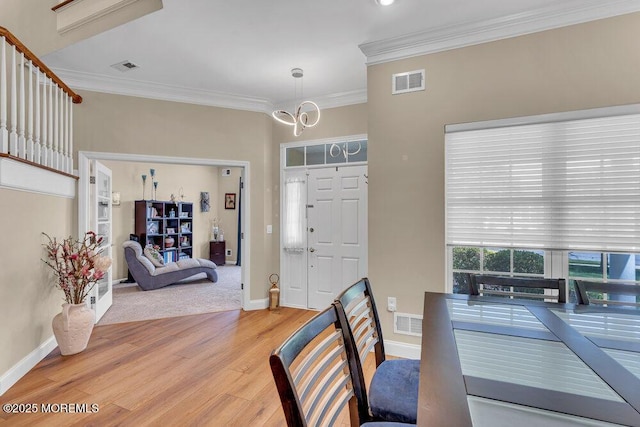 19 Carleton Dr, Freehold, NJ 07728 - dining area with a chandelier, light wood-type flooring, and ornamental molding