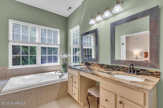 19 Carleton Dr, Freehold, NJ 07728 - full bath with plenty of natural light, double vanity, a garden tub, and tile patterned flooring