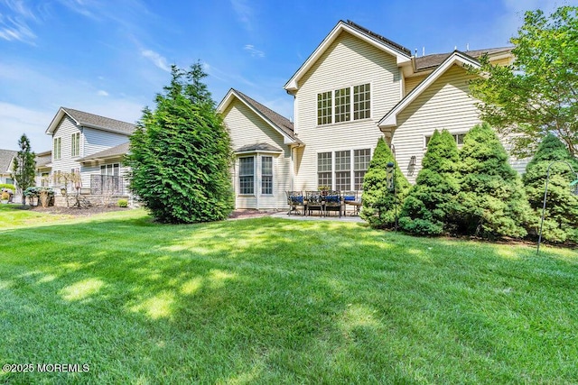 19 Carleton Dr, Freehold, NJ 07728 - rear view of house with a yard and a patio area