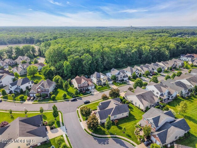 19 Carleton Dr, Freehold, NJ 07728 - aerial perspective of suburban area featuring a heavily wooded area