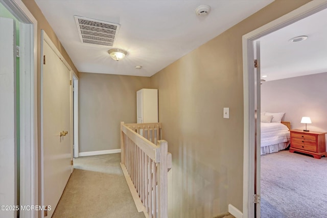 7 Owens Rd, Marlboro, NJ 07746 - hallway featuring an upstairs landing and light carpet