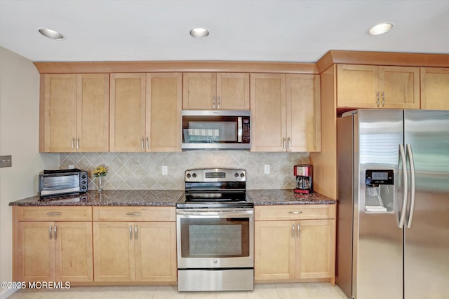 7 Owens Rd, Marlboro, NJ 07746 - kitchen featuring stainless steel appliances, dark stone counters, tasteful backsplash, and recessed lighting