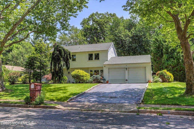7 Owens Rd, Marlboro, NJ 07746 - colonial house with a garage, driveway, and a front lawn