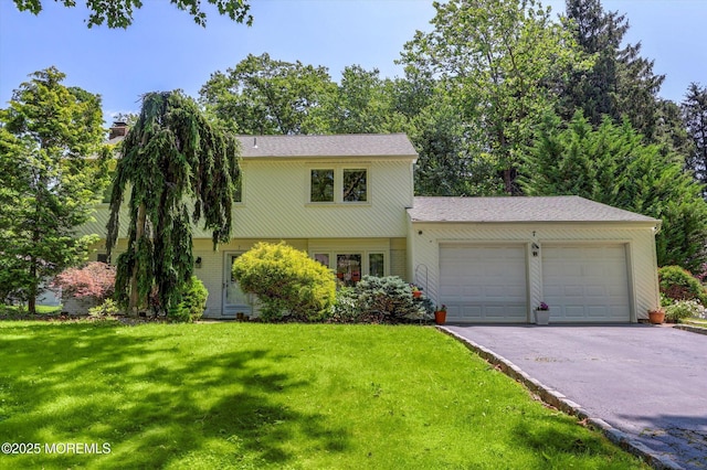 7 Owens Rd, Marlboro, NJ 07746 - view of front of property with an attached garage, asphalt driveway, and a front yard