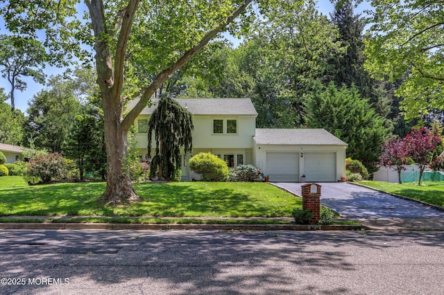 7 Owens Rd, Marlboro, NJ 07746 - view of front of house featuring an attached garage and asphalt driveway
