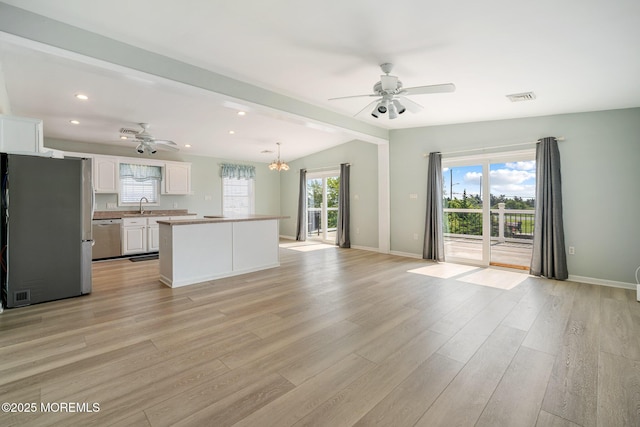 1 S Ensign Dr, Little Egg Harbor, NJ 08087 - unfurnished living room featuring ceiling fan, light wood-style flooring, a chandelier, recessed lighting, and beamed ceiling