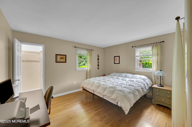 4607 Broad St, Wall, NJ 07753 - bedroom with multiple windows and light wood-style flooring