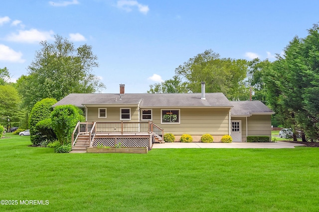 4607 Broad St, Wall, NJ 07753 - rear view of property with a yard, a deck, a chimney, and stairs