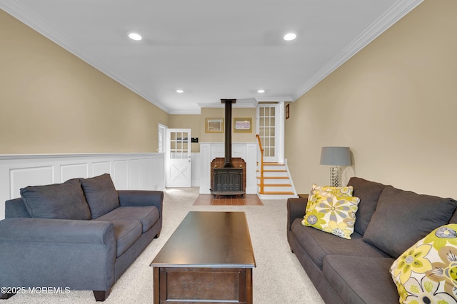 4607 Broad St, Wall, NJ 07753 - living room featuring a wood stove, ornamental molding, recessed lighting, carpet floors, and a wainscoted wall