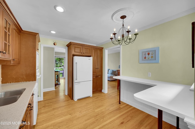 4607 Broad St, Wall, NJ 07753 - kitchen featuring white appliances, crown molding, brown cabinets, light wood-style floors, and recessed lighting