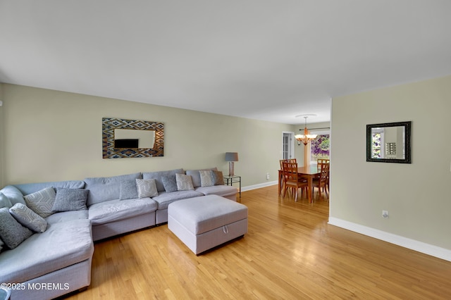 4607 Broad St, Wall, NJ 07753 - living room with a chandelier and light wood-style floors