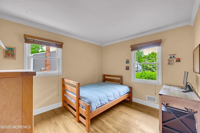 4607 Broad St, Wall, NJ 07753 - bedroom with light wood-style floors, multiple windows, and crown molding