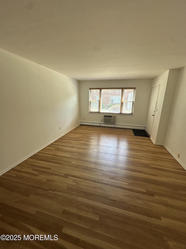 66 Fox Rd Unit 10A, Edison, NJ 08817 - spare room featuring dark wood-style floors and an AC wall unit