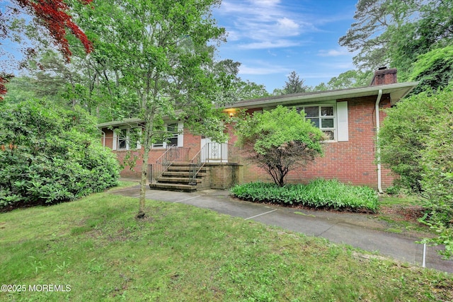 192 Crescent Ave, Jackson, NJ 08527 - view of front of property featuring a chimney, brick siding, and a front lawn