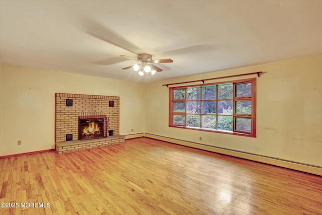 192 Crescent Ave, Jackson, NJ 08527 - unfurnished living room featuring wood finished floors, a ceiling fan, a baseboard heating unit, and a fireplace