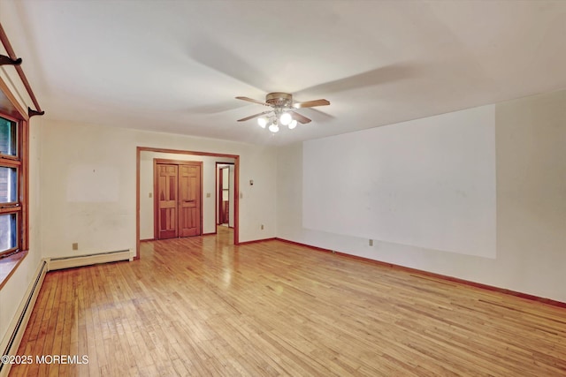 192 Crescent Ave, Jackson, NJ 08527 - spare room with light wood-style floors, a ceiling fan, and a baseboard radiator