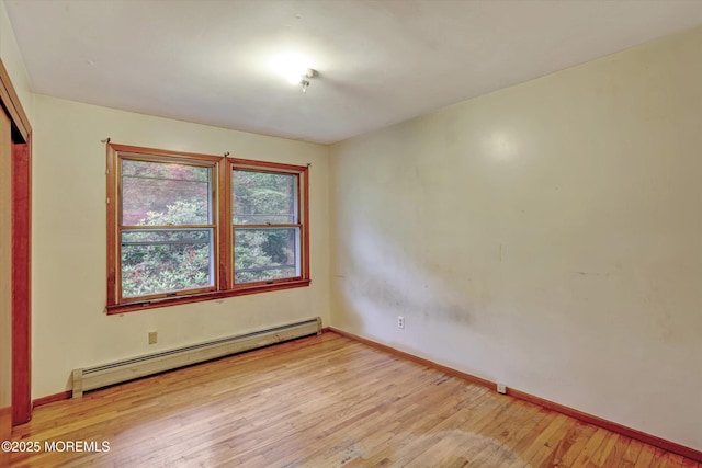 192 Crescent Ave, Jackson, NJ 08527 - empty room featuring a baseboard heating unit and light wood-type flooring
