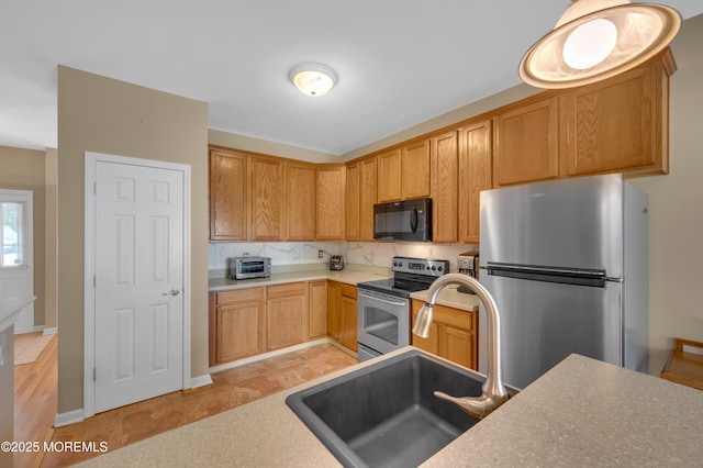 52 Country Walk Blvd, Whiting, NJ 08759 - kitchen featuring appliances with stainless steel finishes, tasteful backsplash, and light countertops