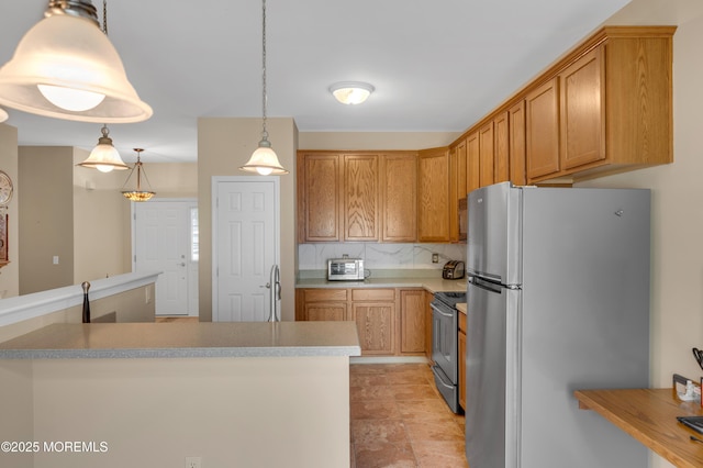 52 Country Walk Blvd, Whiting, NJ 08759 - kitchen with appliances with stainless steel finishes, tasteful backsplash, pendant lighting, and light countertops
