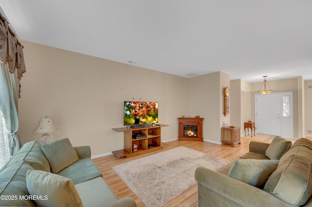 52 Country Walk Blvd, Whiting, NJ 08759 - living area with light wood finished floors and a glass covered fireplace