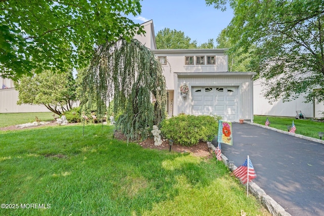 236 Community Cir, Old Bridge, NJ 08857 - view of front facade with asphalt driveway, a garage, and a front yard