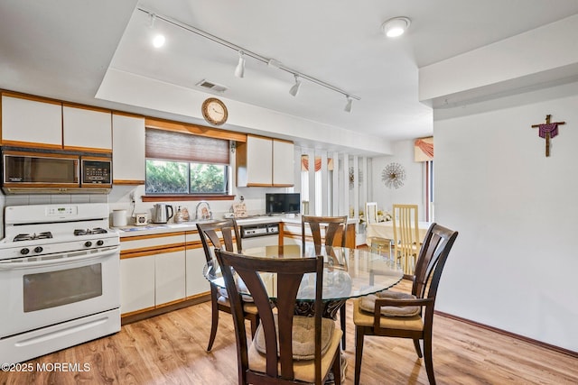 236 Community Cir, Old Bridge, NJ 08857 - dining room featuring track lighting and light wood finished floors
