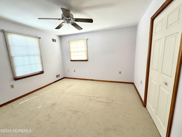 219 Newark Rd S, Barnegat, NJ 08005 - unfurnished bedroom featuring light colored carpet, a ceiling fan, and a closet
