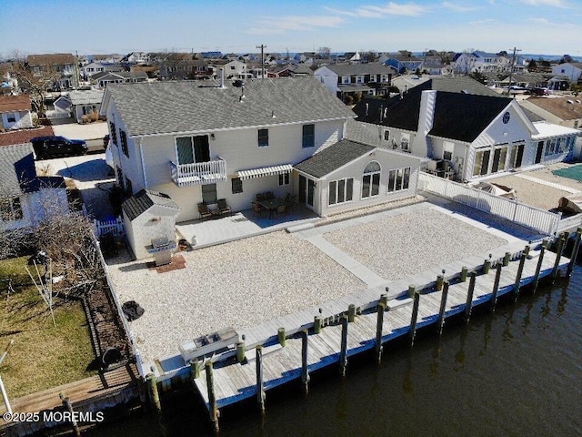 219 Newark Rd S, Barnegat, NJ 08005 - rear view of property with a patio, a residential view, a shingled roof, and a fenced backyard