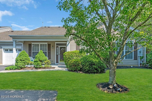 44 Autumntide Dr, Lakewood, NJ 08701 - view of front of home with an attached garage, a front yard, and a shingled roof