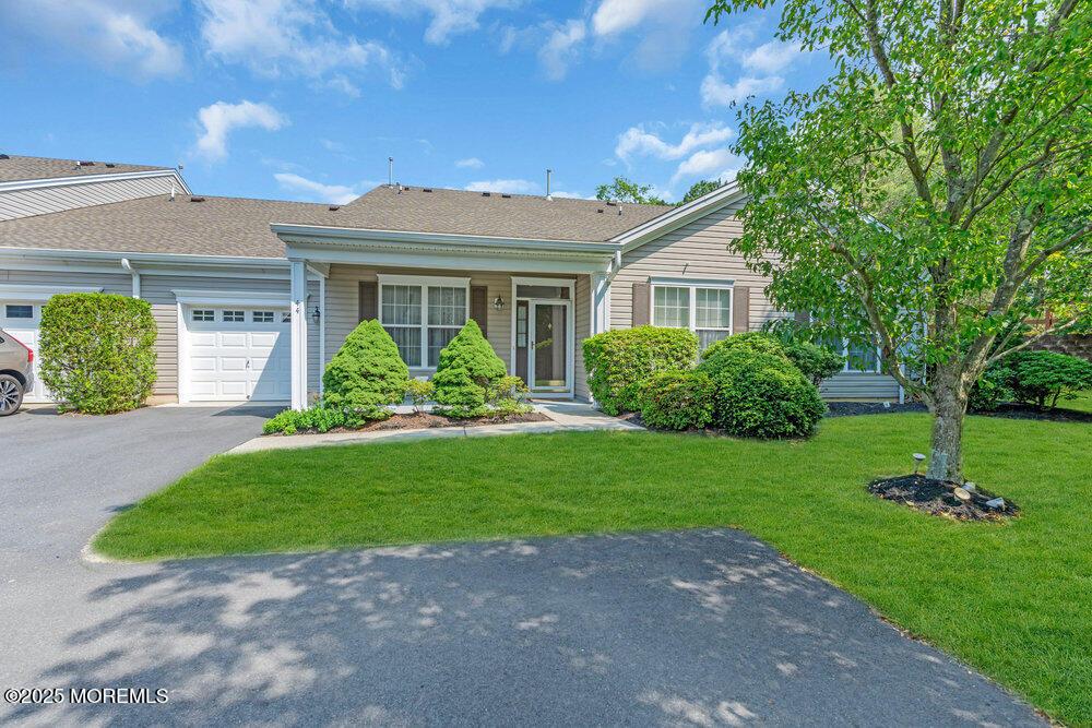 44 Autumntide Dr, Lakewood, NJ 08701 - view of front of property with an attached garage, a front yard, asphalt driveway, and a shingled roof