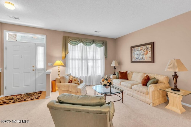 44 Autumntide Dr, Lakewood, NJ 08701 - carpeted living room with baseboards and a textured ceiling