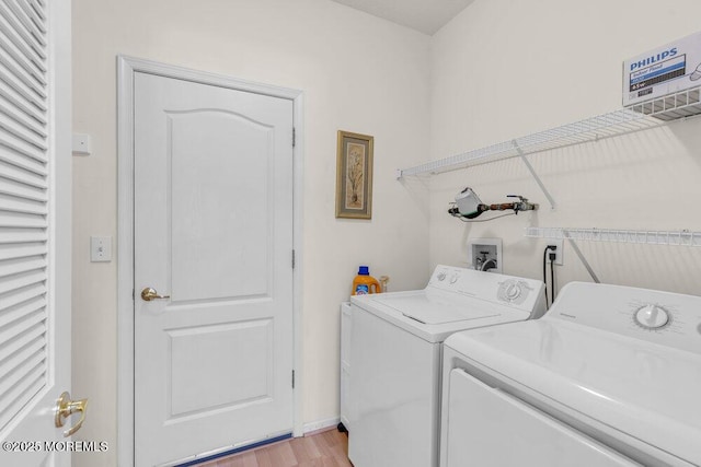 44 Autumntide Dr, Lakewood, NJ 08701 - laundry room with washing machine and dryer and light wood-style floors