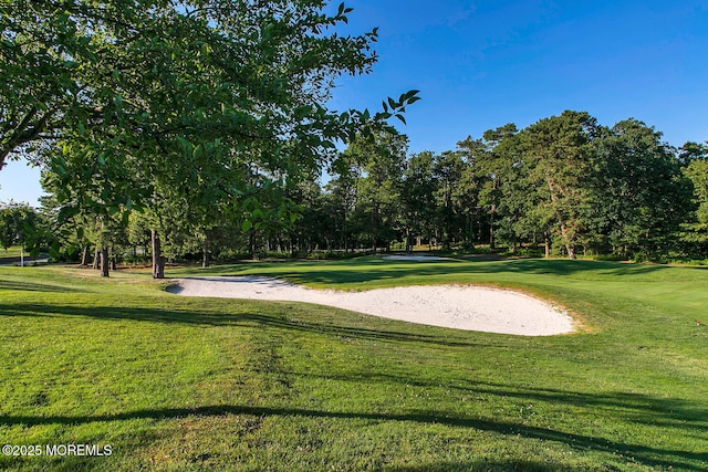 44 Autumntide Dr, Lakewood, NJ 08701 - surrounding community with a lawn, view of scattered trees, and view of golf course