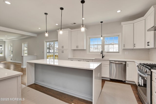 413B Lake Shr, Brick, NJ 08723 - kitchen featuring appliances with stainless steel finishes, recessed lighting, plenty of natural light, and white cabinetry