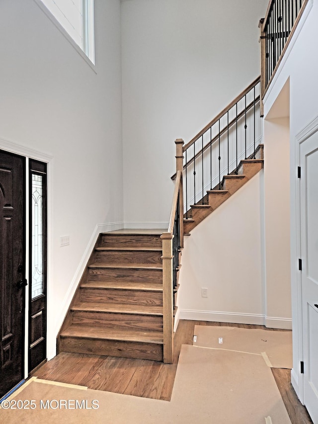 413B Lake Shr, Brick, NJ 08723 - foyer entrance with stairway, wood finished floors, and a towering ceiling