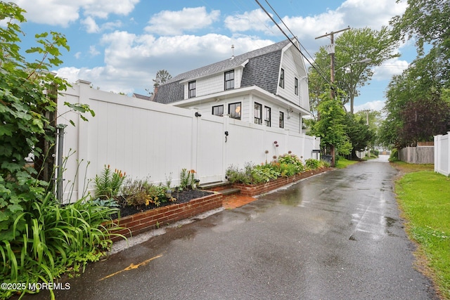 13031/2 Langford St, Asbury Park, NJ 07712 - view of property exterior featuring roof with shingles and a gambrel roof