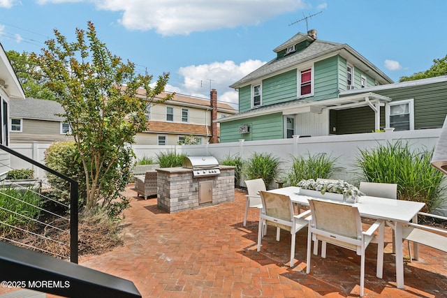 13031/2 Langford St, Asbury Park, NJ 07712 - fenced backyard with area for grilling, a patio, and outdoor dining space