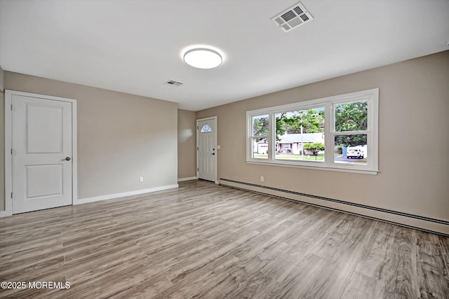 48 Sheepshead Dr, Toms River, NJ 08757 - spare room with a baseboard radiator and light wood-style flooring