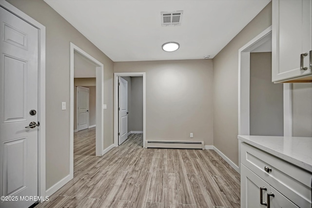48 Sheepshead Dr, Toms River, NJ 08757 - unfurnished dining area featuring baseboard heating and light wood finished floors