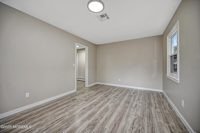 48 Sheepshead Dr, Toms River, NJ 08757 - unfurnished room featuring wood finished floors and a baseboard radiator