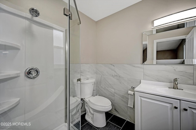 48 Sheepshead Dr, Toms River, NJ 08757 - bathroom with tile walls, vanity, a stall shower, a wainscoted wall, and tile patterned floors