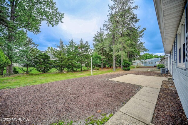 48 Sheepshead Dr, Toms River, NJ 08757 - view of green lawn featuring a patio